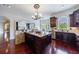 Open-concept kitchen with a large center island, dark wood cabinets, and stainless steel appliances at 510 Belada Blvd, Atlanta, GA 30342