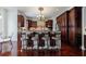 Spacious kitchen boasts a center island with seating, dark wood cabinetry, and modern appliances at 510 Belada Blvd, Atlanta, GA 30342