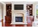 Elegant living room featuring a fireplace with a decorative mantle and built-in bookshelves at 510 Belada Blvd, Atlanta, GA 30342
