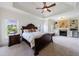 Spacious main bedroom features a trey ceiling, fireplace, built-in shelving, and elegant furnishings at 510 Belada Blvd, Atlanta, GA 30342