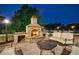 Beautiful outdoor living space featuring a stone fireplace and cozy seating area at 510 Belada Blvd, Atlanta, GA 30342