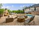 Beautiful outdoor patio area with a brick fireplace, ample seating, and a view of the pool at 510 Belada Blvd, Atlanta, GA 30342