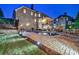 Night view of the pool and outdoor patio area complete with fireplace and barbeque at 510 Belada Blvd, Atlanta, GA 30342
