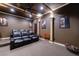 Home theater room with plush seating, projector, and dim lighting for an immersive experience at 510 Belada Blvd, Atlanta, GA 30342