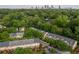 Aerial view of lush, green townhome community with mature trees, downtown skyline at 732 Province Se Pl, Atlanta, GA 30312