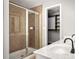 Bathroom featuring tiled shower and double vanity with a view to a walk-in closet at 732 Province Se Pl, Atlanta, GA 30312