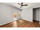 Bedroom featuring hardwood floors, ceiling fan and access to patio at 732 Province Se Pl, Atlanta, GA 30312