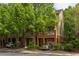 Inviting townhome featuring a brick facade, charming balcony and lush landscaping at 732 Province Se Pl, Atlanta, GA 30312