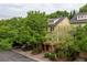Townhome featuring a brick facade, charming balcony and lush landscaping at 732 Province Se Pl, Atlanta, GA 30312