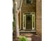 Front door with sidelights and transom, brick facade and stone pathway, showcasing a welcoming entrance at 732 Province Se Pl, Atlanta, GA 30312