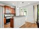 A kitchen featuring wooden cabinets and an island, with a doorway leading to an outdoor patio at 732 Province Se Pl, Atlanta, GA 30312