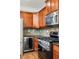 A kitchen featuring wooden cabinets, stainless steel appliances, and an under-counter wine cooler at 732 Province Se Pl, Atlanta, GA 30312