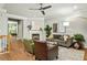 A spacious living room featuring hardwood floors and a fireplace, alongside open access to the dining area at 732 Province Se Pl, Atlanta, GA 30312