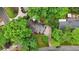 Aerial view of home surrounded by mature trees in a wooded neighborhood at 1426 Diamond Head Dr, Decatur, GA 30033
