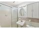 Clean and bright bathroom with glass shower, vanity, and tiled accents at 1426 Diamond Head Dr, Decatur, GA 30033