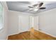 The bedroom features a ceiling fan, closet, and hardwood flooring at 1426 Diamond Head Dr, Decatur, GA 30033