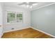 Bright bedroom featuring hardwood floors, large windows, and neutral paint at 1426 Diamond Head Dr, Decatur, GA 30033