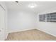 Bedroom with light wood floors, a closet, and a window bringing in natural light at 1426 Diamond Head Dr, Decatur, GA 30033