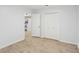 The bright bedroom has light wood floors and large closets at 1426 Diamond Head Dr, Decatur, GA 30033