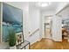 Bright hallway with hardwood floors leads to kitchen and dining area at 1426 Diamond Head Dr, Decatur, GA 30033