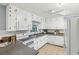 White kitchen with updated stainless-steel appliances, stone countertops, and bright lighting at 1426 Diamond Head Dr, Decatur, GA 30033