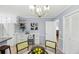 Charming kitchen with stylish eat-in area, neutral paint, plentiful cabinet space, and modern lighting at 1426 Diamond Head Dr, Decatur, GA 30033