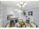 Bright kitchen with eat-in bar, stylish countertops, white cabinetry, and modern fixtures at 1426 Diamond Head Dr, Decatur, GA 30033