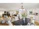 Open-concept living room featuring hardwood floors, stylish furniture, and a cozy dining area at 1426 Diamond Head Dr, Decatur, GA 30033