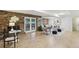 Living room features a brick wall, French doors, and a cozy seating area at 1426 Diamond Head Dr, Decatur, GA 30033