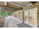 A covered patio of a brick home featuring a metal roof and open access to the home at 1426 Diamond Head Dr, Decatur, GA 30033