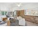 Sunroom with brick accents, stylish furniture, and plenty of natural light at 1426 Diamond Head Dr, Decatur, GA 30033