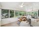 Sunroom featuring a ceiling fan, windows overlooking the backyard, and comfortable seating at 1426 Diamond Head Dr, Decatur, GA 30033
