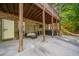 Covered back patio with outdoor furniture, a grill, and a relaxing hot tub at 1520 Windsong Park Dr, Dacula, GA 30019
