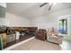 Partially finished basement with a cozy seating area, a guitar, and ample natural light at 1520 Windsong Park Dr, Dacula, GA 30019