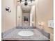 Well-lit bathroom with granite countertop, modern fixtures, and a clean design at 1520 Windsong Park Dr, Dacula, GA 30019