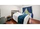 Cozy bedroom with dark wood furniture, hardwood floors, and natural light at 1520 Windsong Park Dr, Dacula, GA 30019