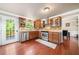 Bright kitchen with stainless steel appliances, wood cabinets, and a view to the deck at 1520 Windsong Park Dr, Dacula, GA 30019