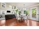 Bright living area with hardwood floors, high ceilings, large windows, and a door leading to the outside at 1520 Windsong Park Dr, Dacula, GA 30019