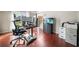 Home office featuring a sit-stand desk, fish tank and natural light at 1520 Windsong Park Dr, Dacula, GA 30019