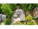Aerial view of a well-manicured property featuring a house with a long driveway at 2140 Azalea Dr, Roswell, GA 30075