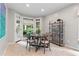 Charming breakfast nook with a round table, shelving and natural light at 2140 Azalea Dr, Roswell, GA 30075