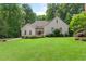 Elegant single-Gathering home with lush lawn and mature landscaping at 2140 Azalea Dr, Roswell, GA 30075