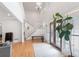 Bright foyer featuring hardwood floors, a staircase to the second story, and a modern chandelier at 2140 Azalea Dr, Roswell, GA 30075