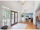 Foyer with hardwood floors, plantation shutters, and a glimpse into an adjacent bedroom at 2140 Azalea Dr, Roswell, GA 30075