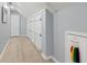 Hallway featuring ample storage space, closet doors, and recessed lighting, enhancing functionality and design at 2140 Azalea Dr, Roswell, GA 30075