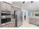 Modern kitchen with stainless steel appliances, granite countertops, and ample storage space at 2140 Azalea Dr, Roswell, GA 30075