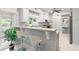 Stylish kitchen bar with granite countertops, white cabinets, and natural light at 2140 Azalea Dr, Roswell, GA 30075
