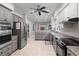 Well-lit kitchen with granite countertops, stainless steel appliances, and modern cabinetry at 2140 Azalea Dr, Roswell, GA 30075