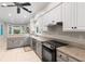 Kitchen featuring granite countertops, stainless steel appliances, and ample counter space at 2140 Azalea Dr, Roswell, GA 30075