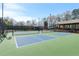 Community pickleball courts with benches and covered area, surrounded by trees at 2140 Azalea Dr, Roswell, GA 30075